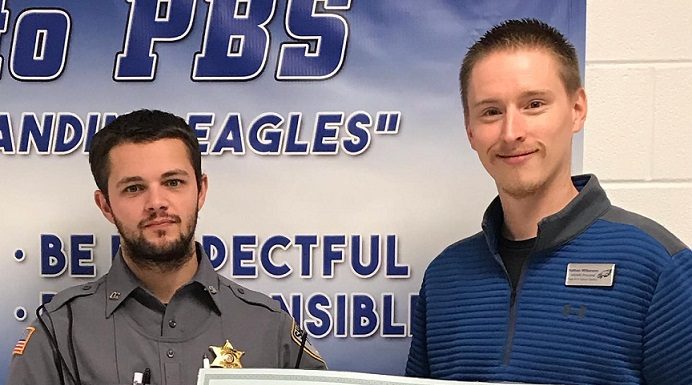 “No Shave November” funds given to Shop with a Hero program