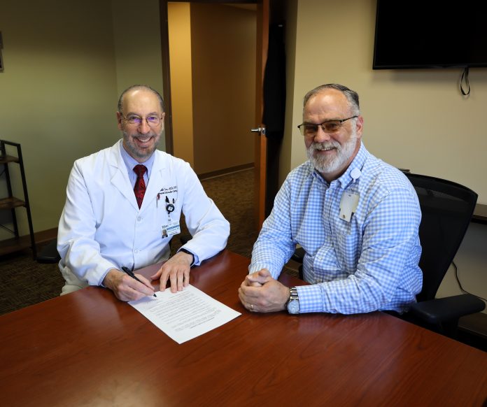 Dr Tidmore signs a two year contract extension 3.10.25