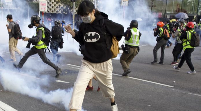 Hong Kong pro-democracy rally cut short by police tear gas
