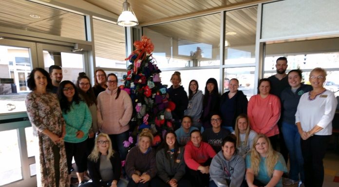 Nursing program presents hats, gloves to pregnancy crisis center