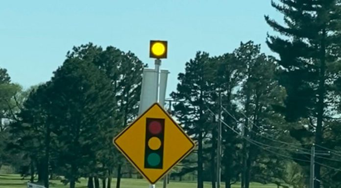 Flashing caution lights now on Highway 63