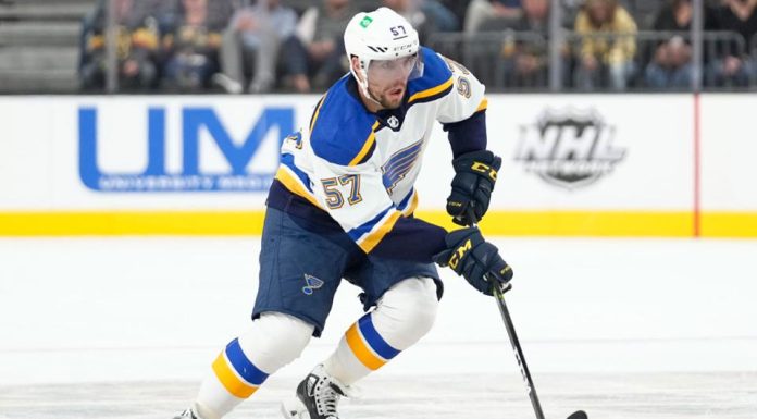 Perron leaves game with upper-body injury