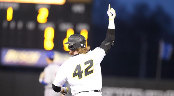 Leum Leads 14-6 Rout of Kansas