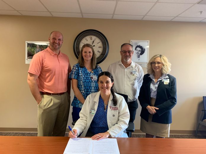 Dr. Benoist signing with team