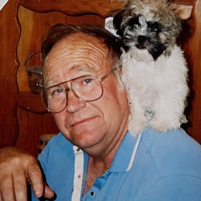 Charles Burrell with dog on shoulder (2)