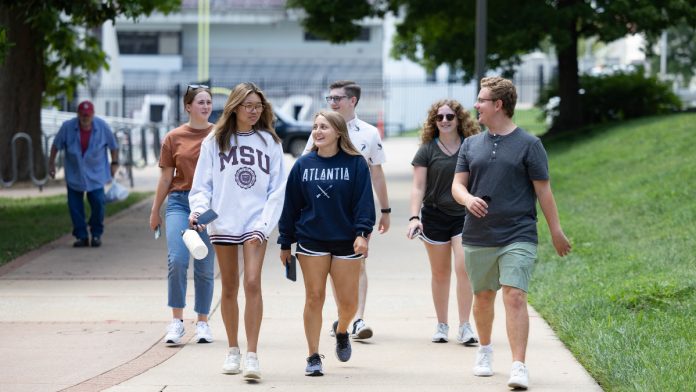 students walking move in