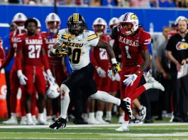 Football Pulls Away in 38-21 Border War Victory over Kansas